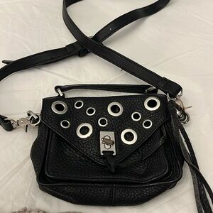 Rebecca Minkoff black mini bag with grommet detail with extra shoulder strap